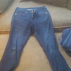 Gently worn seven jeans with rhinestone buttons